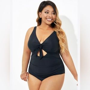 Brand new flattering tummy control bathing suit with tie and cutout